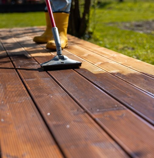 spreading stain on a deck